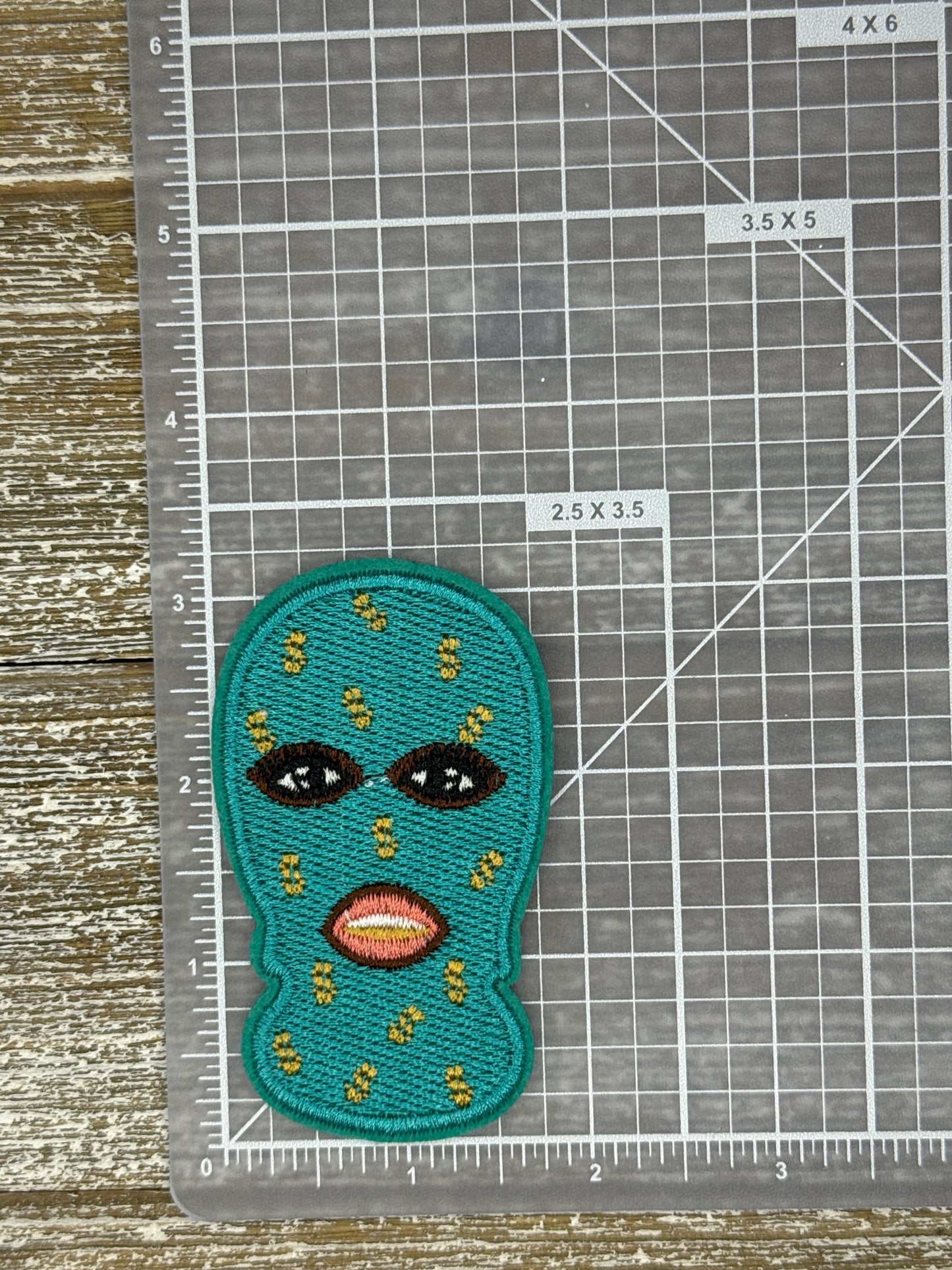 Purple/ Teal Masked Baddie