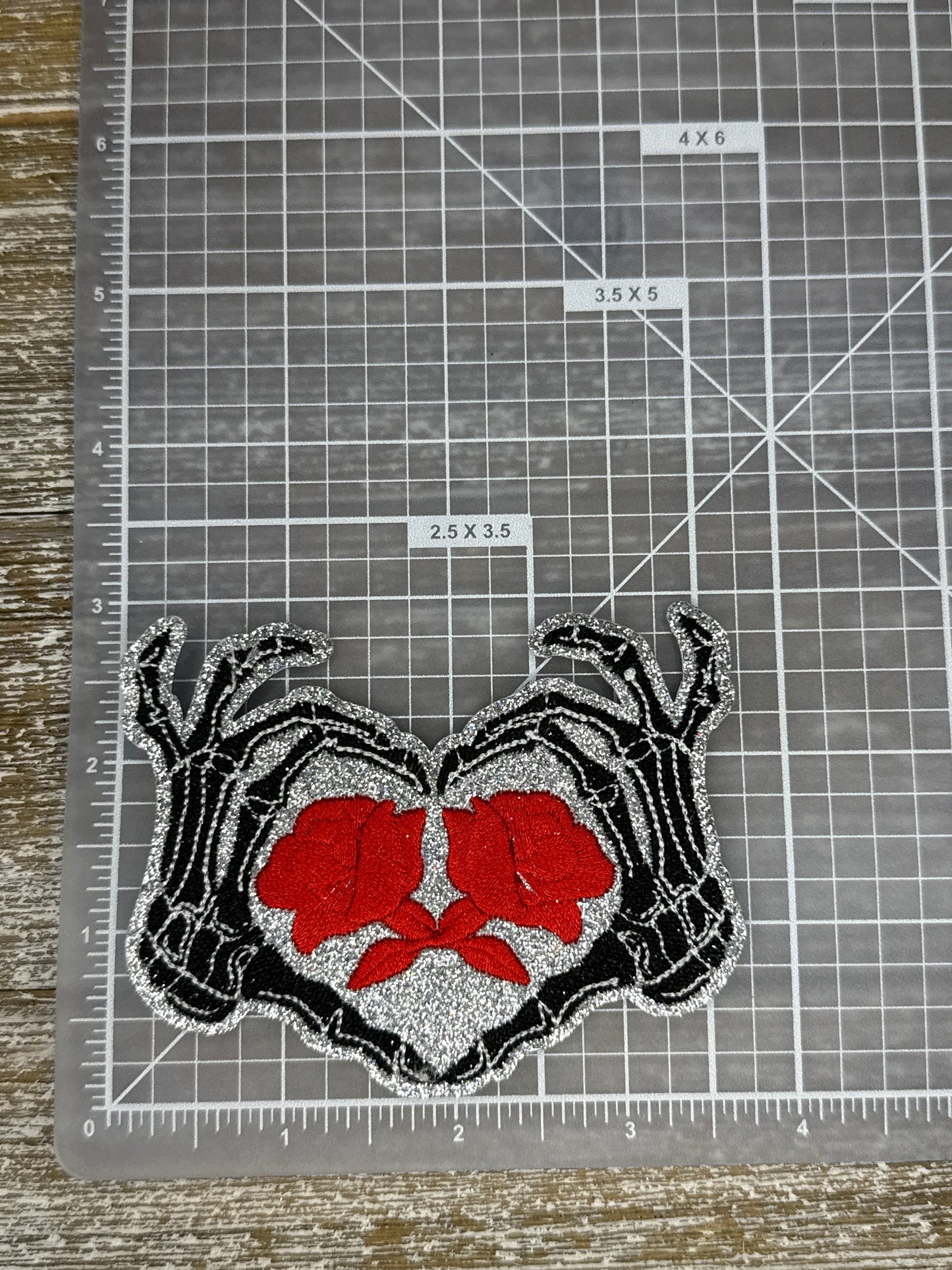 Silver Glitter Skeleton Heart Hands W/ Roses